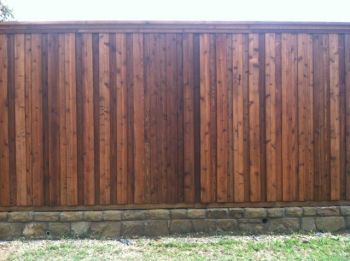 Wood Fence on Stone Retaining Wall