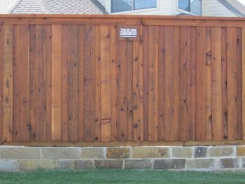 Wood Fence on top of a retaining Wall