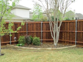 Wood Stained Fence and Flagstone Wall
