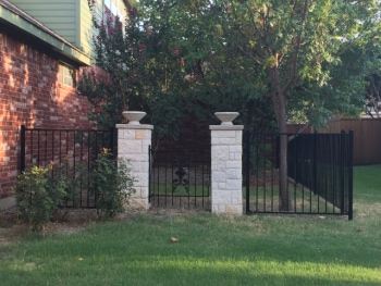 Iron Fence with Stone Pillars