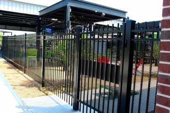 Black steel privacy fencing at Chicken N Pickle
