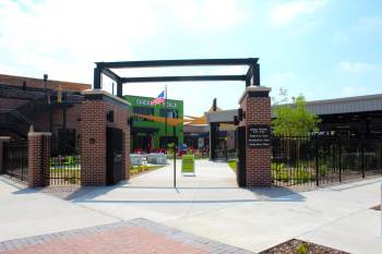 Main entrance to Chicken N Pickle with custom steel fencing