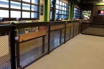 Indoor court fencing at Chicken N Pickle