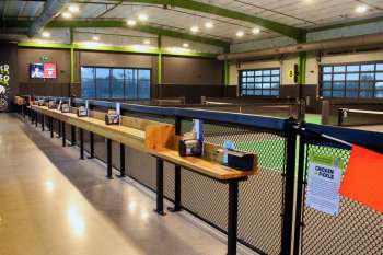 Dining bar and fencing inside Chicken N Pickle