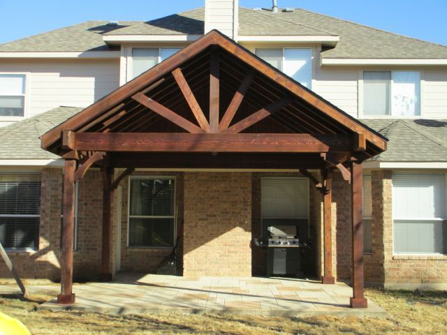 Covered patio structure over a backyard living area in DFW built by Texas Best Fence & Patio