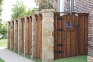  wood fence with stone columns