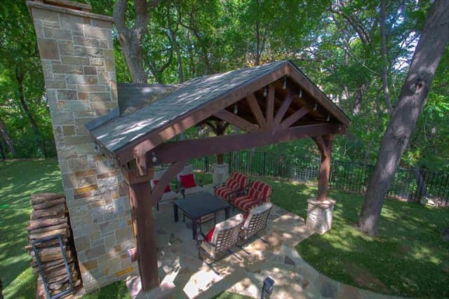 patio cover and pergola perks - pergola over outdoor living space with fireplace