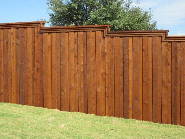 Fence etiquette - board on board stained wood fence