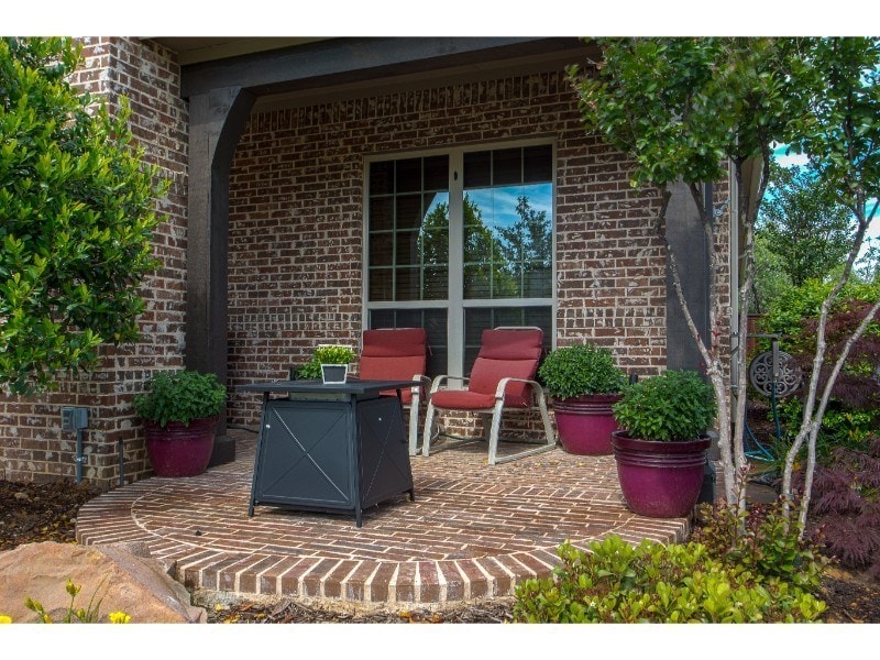 Outdoor Living - small brick patio area with seating and table