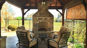 Outdoor Fire Features - Stone Fireplace Under Patio Cover