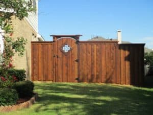 hardscape maintenance - wood fence with wrought iron detailing