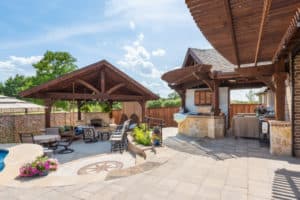 construction contractor - backyard oasis with patio covers and stonework