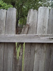 wood fencing - old wood fence with damaged and missing boards