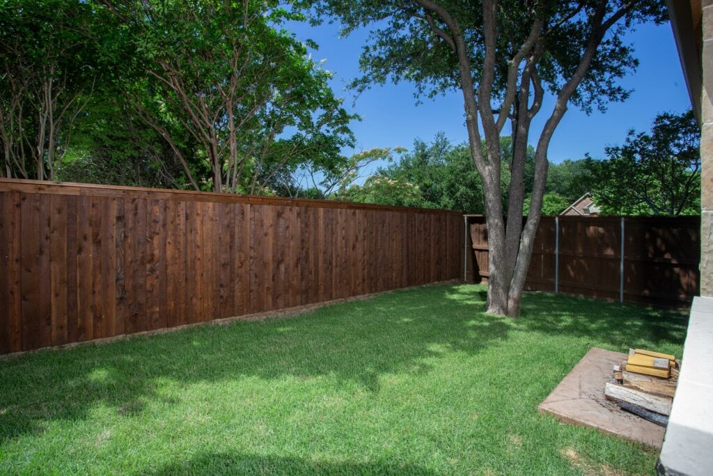 Backyard with a wood fence - 9 Essential Tips for Building a Fence