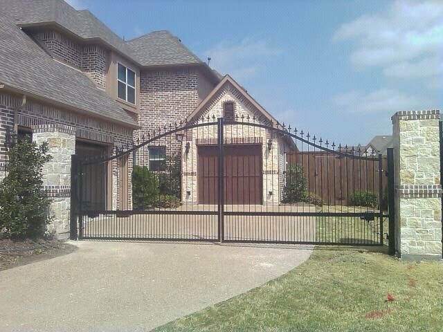 swing gate - wrought iron swing gate at entrance of home