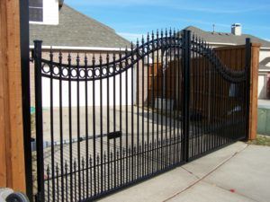 choosing the right fence - automatic wrought iron swing gate