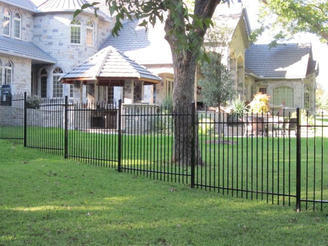 iron fence - wrought iron fence surrounding backyard